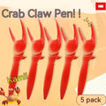 Crab claw novelty ballpoint pen with a pressable metal can clip on a white background.