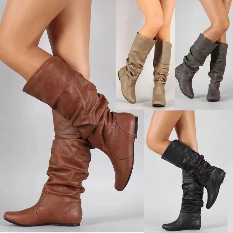 Women's flat heel slip-on ankle boot in artificial PU leather with a round toe and high cylinder sock.