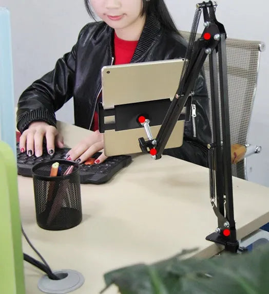 Black and white adjustable phone and tablet stand on a flat surface