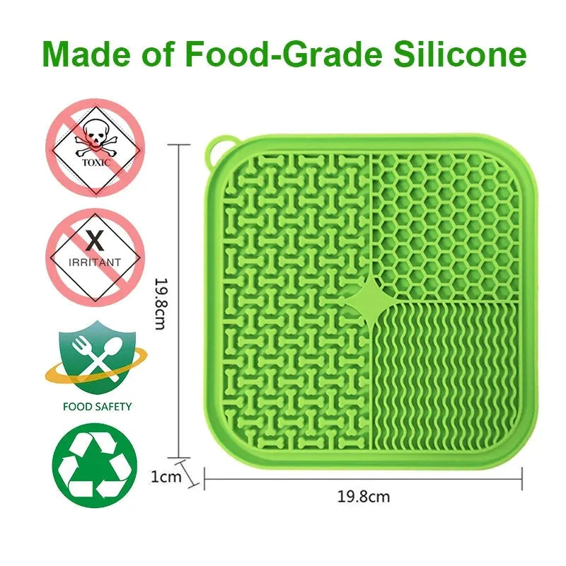 Blue silicone dog lick mat with textured pattern and suction cups on a table.
