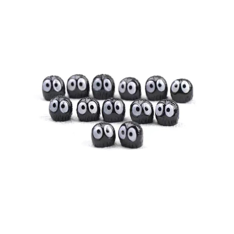 Small black resin briquette car dashboard decoration with cartoon coal ball design