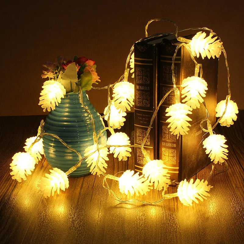 Battery-powered LED light string with plastic pine cone shells, shown in warm white and colour options.