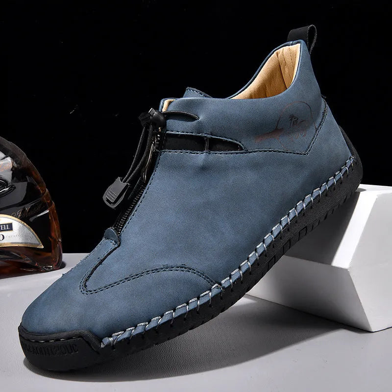 Men's casual leather shoes in black with a mid heel, rounded toe, and reinforced leather upper.