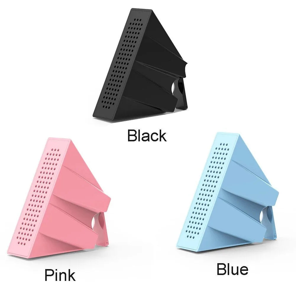 ABS mini mobile phone amplifier bracket in pink, holding a smartphone horizontally on a desktop.
