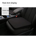 Black car seat heightening cushion with thick 6cm foam build on a car seat