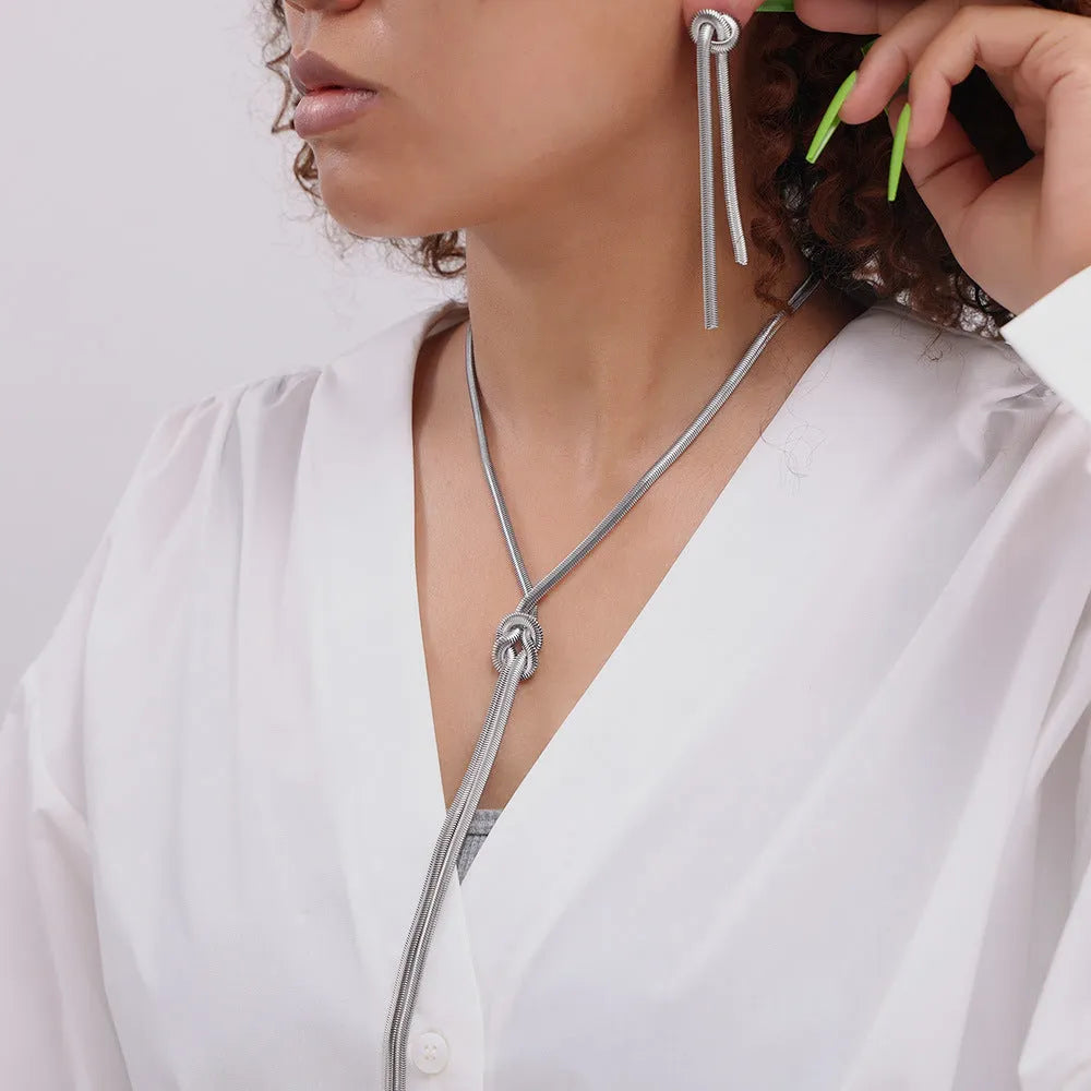 Gold knotted tassel pendant on snake chain necklace with matching earrings set