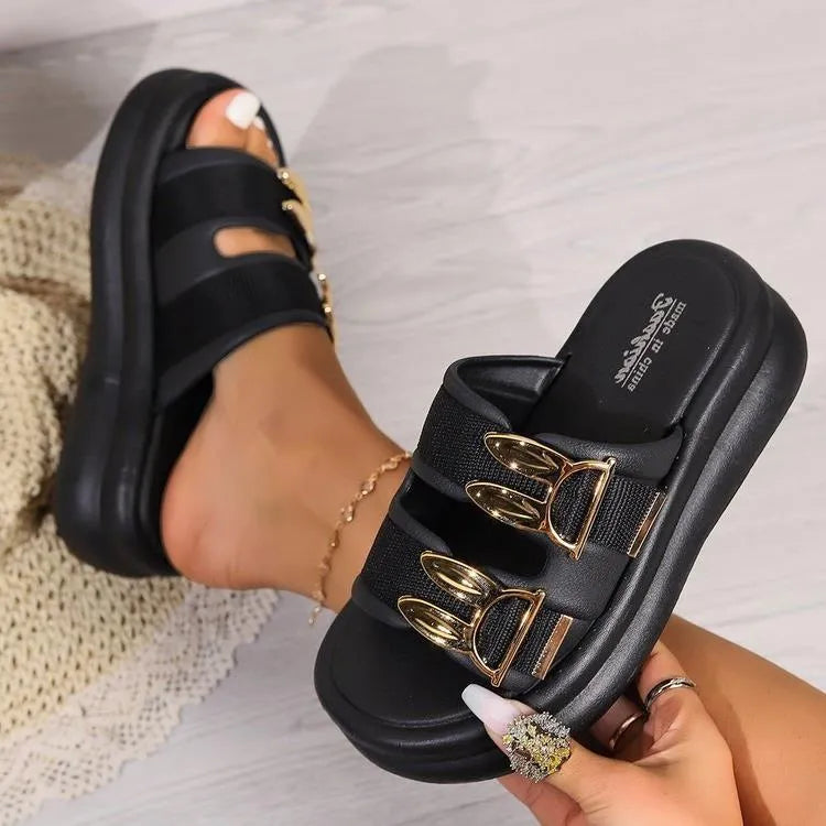 Women's suede slippers in apricot colour with a thick rubber sole.