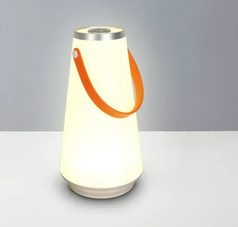 White rechargeable LED bedside lamp with square base measuring 12cm, showing warm white illumination from six LED beads