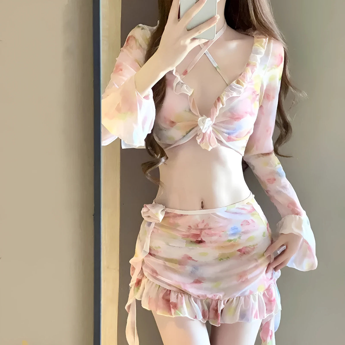 Women's cherry blossom pink floral print bikini swimsuit set on a white background.