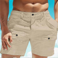 Men's khaki linen shorts with elastic waistband and button pockets laid flat.