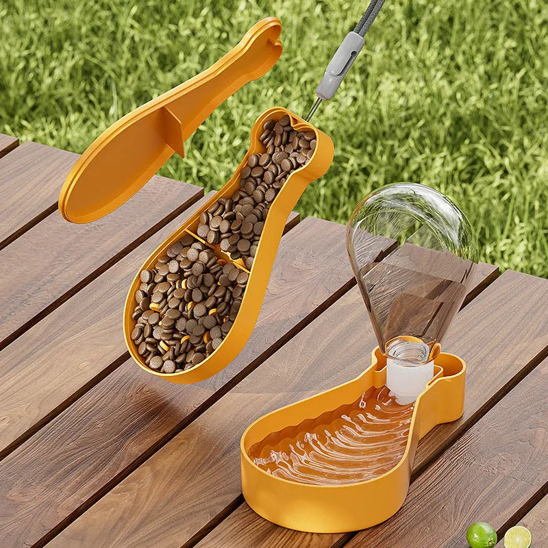 Orange and white portable pet water feeder with food container, showing carrying sling and dual compartments