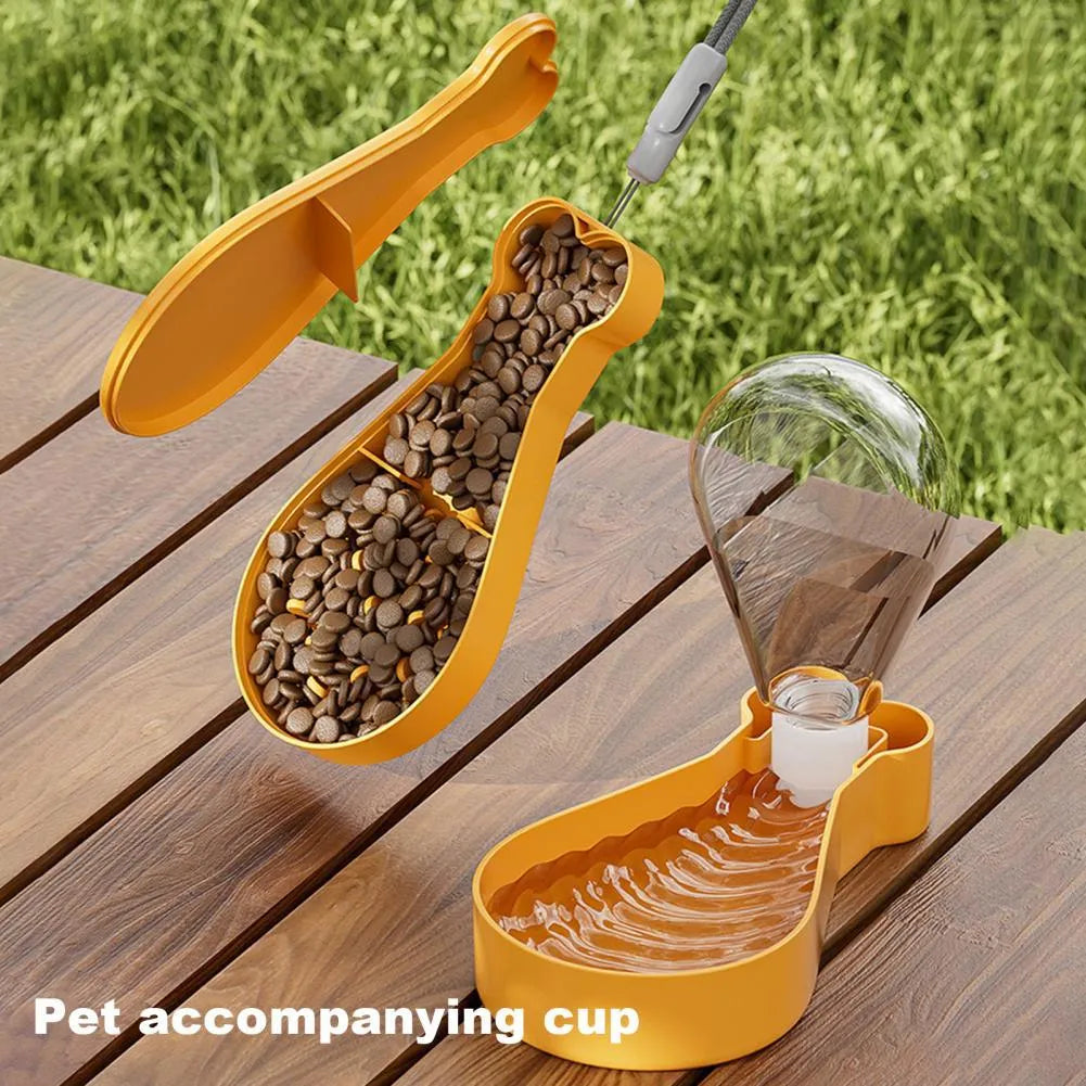 Orange and white portable pet water feeder with food container, showing carrying sling and dual compartments