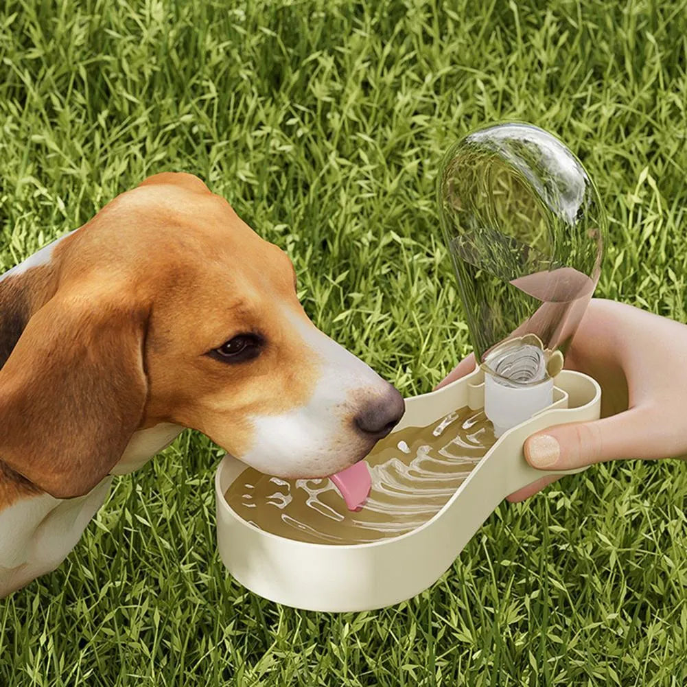 Orange and white portable pet water feeder with food container, showing carrying sling and dual compartments