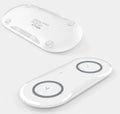 Black and white dual wireless charger charging Samsung and iPhone phones simultaneously