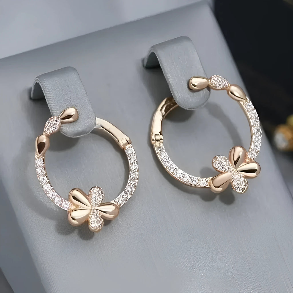 A pair of round copper hoop earrings for women with an electroplated finish.