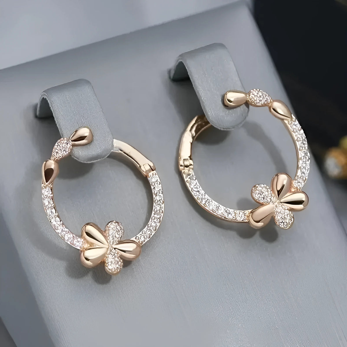 A pair of round copper hoop earrings for women with an electroplated finish.