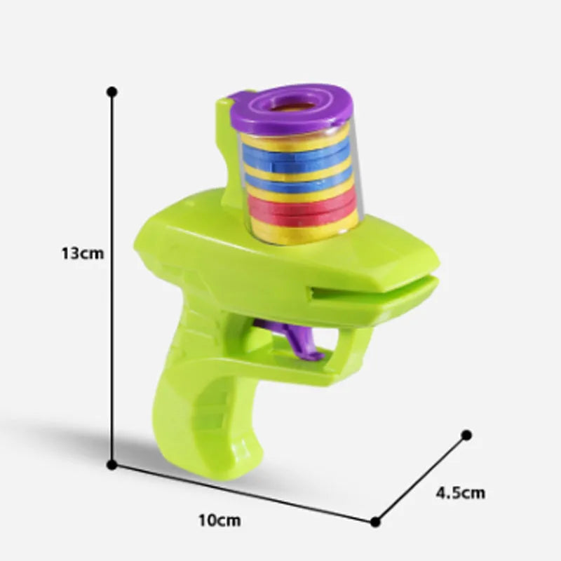 Green interactive battery-free cat toy launcher with foam disc on a floor.
