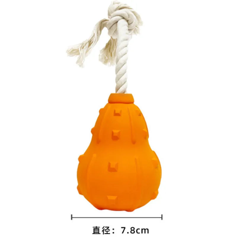 Natural rubber stuffable dog toy with a long strap for fetch, shown with treats inside the hollow centre.