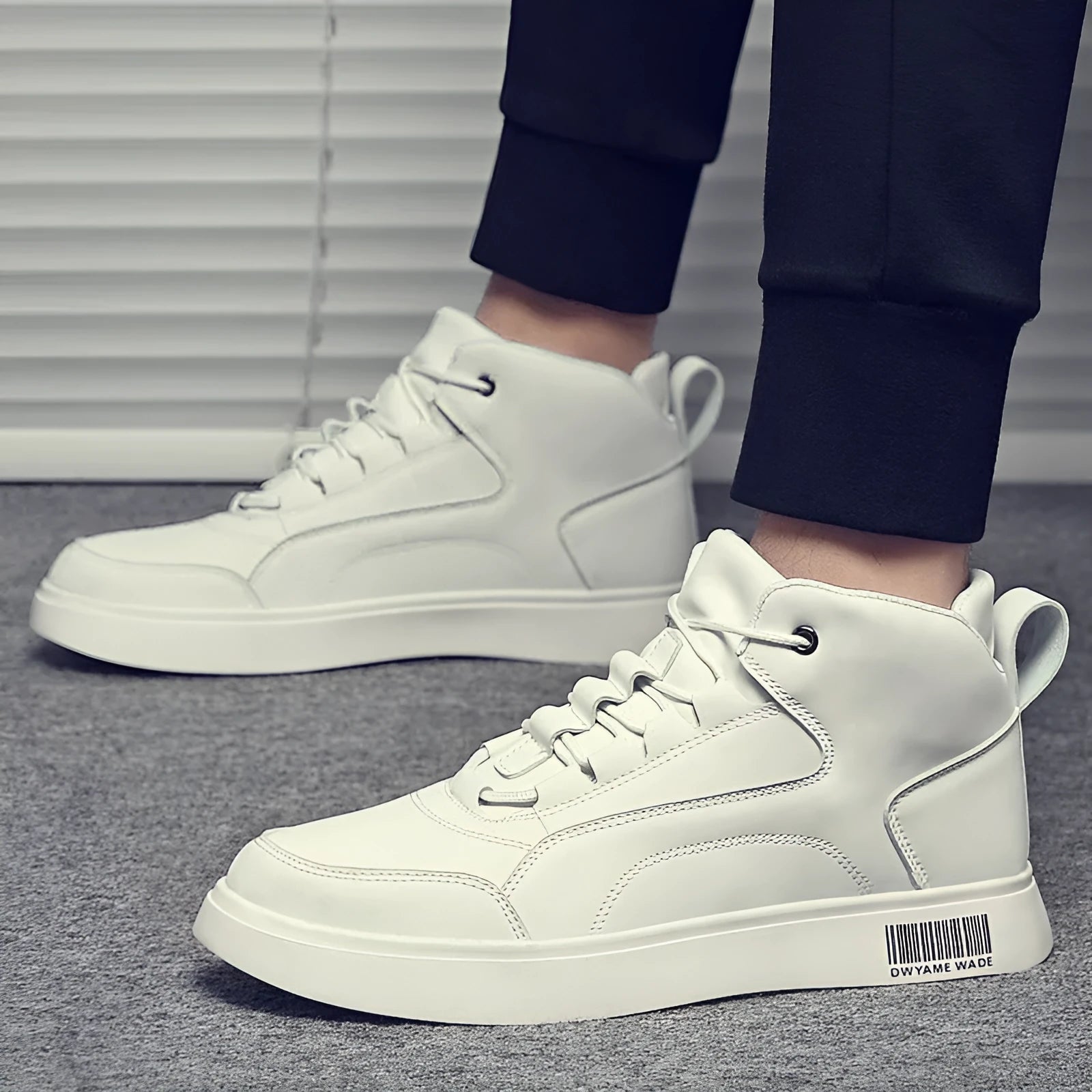 Men's white board shoes with lace-up front and round toe design on rubber sole