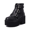 Black women's punk style short boots with bat buckle, thick heel, and side zipper.