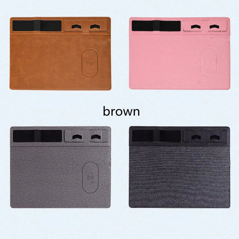 Pink multifunctional wireless charging mouse pad with integrated mobile phone holder on a desk