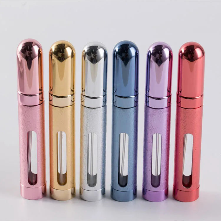 12ml aluminium portable perfume bottle in bullet shape with glass liner, shown in various colours.