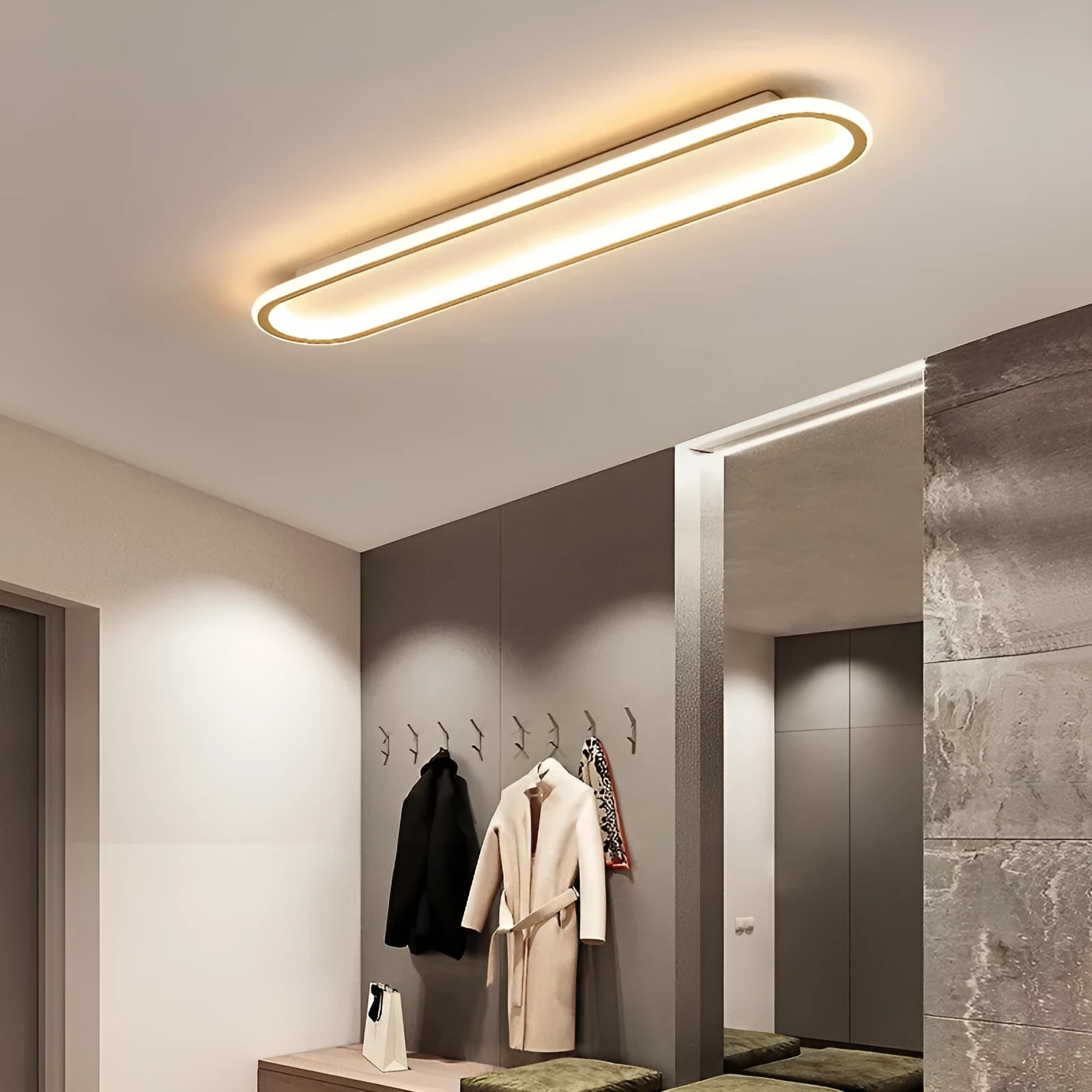 A sleek, linear black strip ceiling lamp with a PVC shade mounted on a white ceiling.