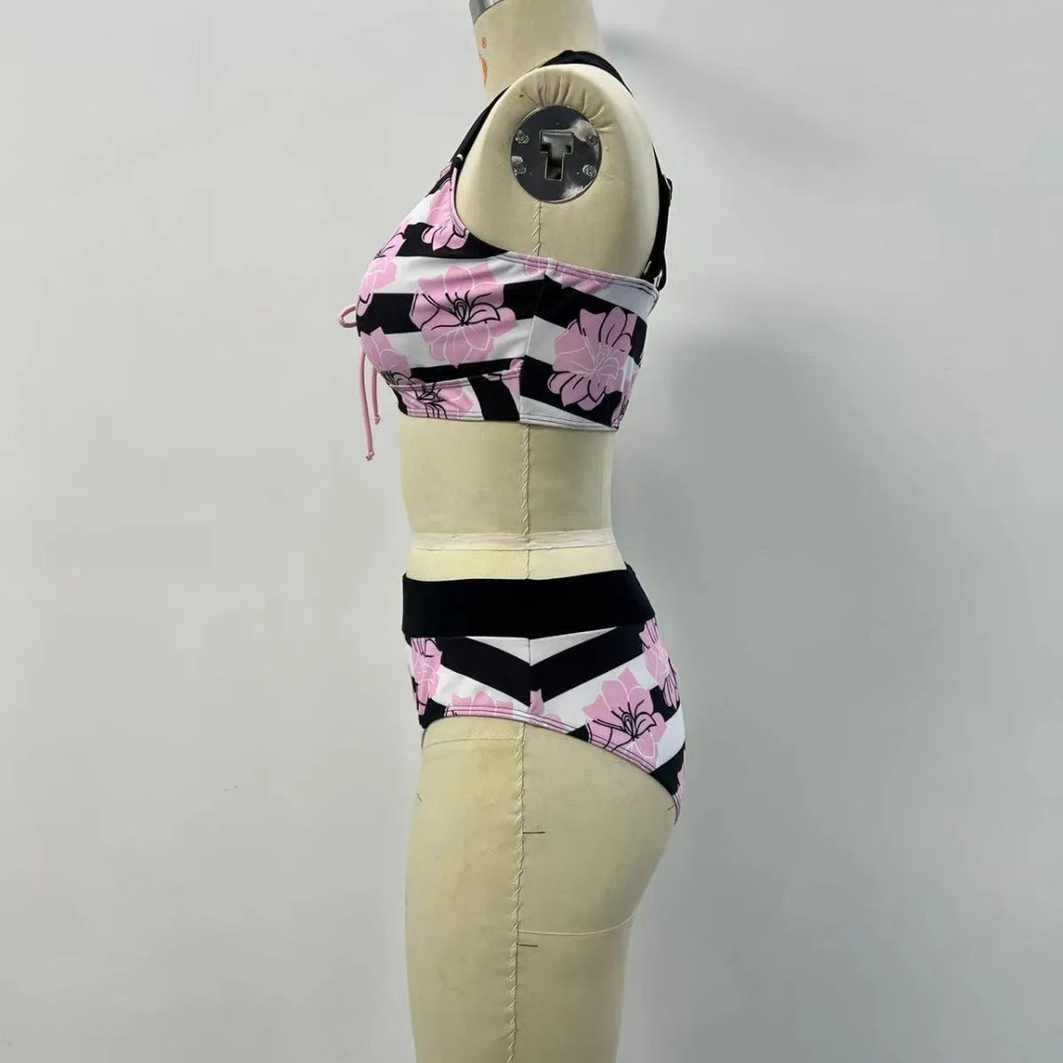 Black women's high-waisted bikini with a slimming belly-covered brief and split top.