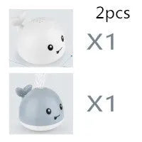 Whale-shaped bath toy with water spray feature and LED lights for baby bath time sensory play