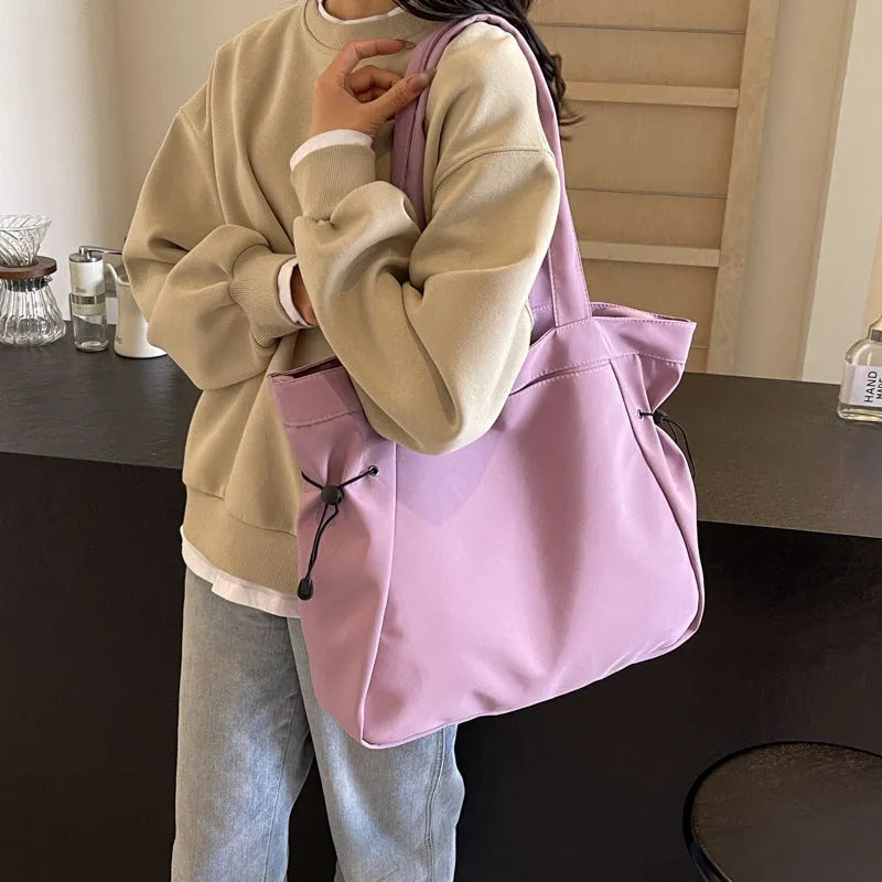 Soft folding Oxford cloth tote bag with shoulder handle in multiple colour options.
