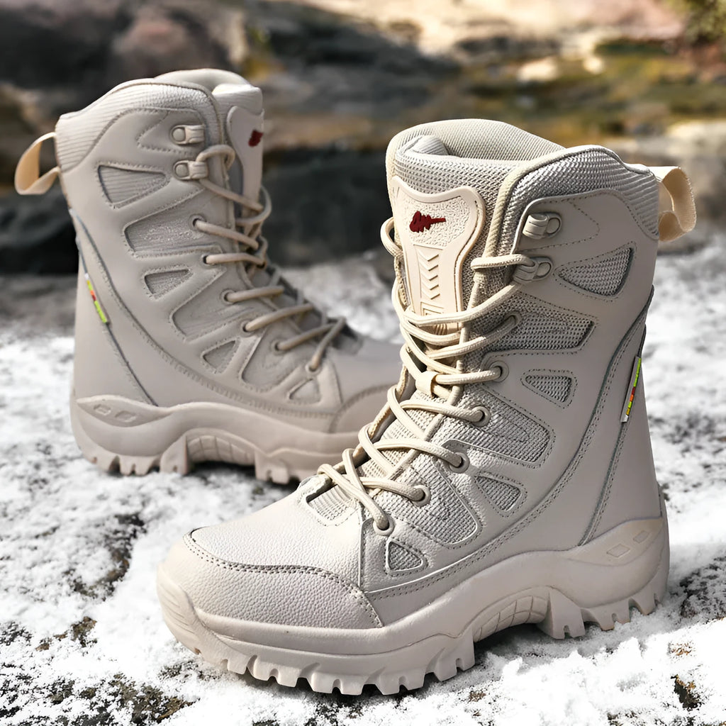 Men's beige cowhide leather hi-top hiking shoes on a rocky outdoor trail