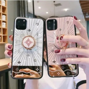 Gold-plated diamond ring phone stand attached to iPhone back in rose gold and white gold colours
