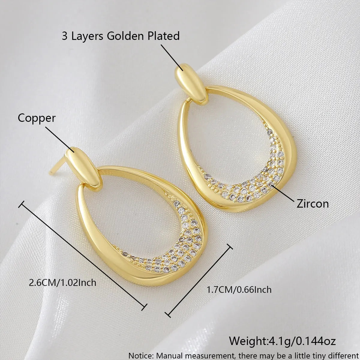 Yellow gold geometric drop earrings with round and oval ring elements on white background