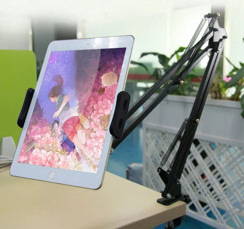 Black and white adjustable phone and tablet stand on a flat surface