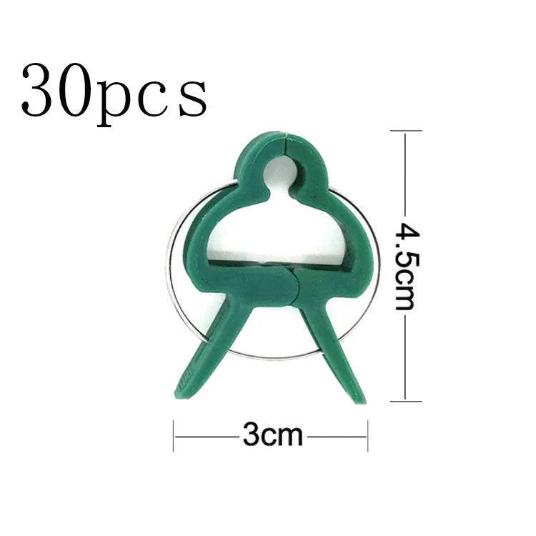 Green plastic and zinc plant fixing clips for supporting climbing tomatoes and beans