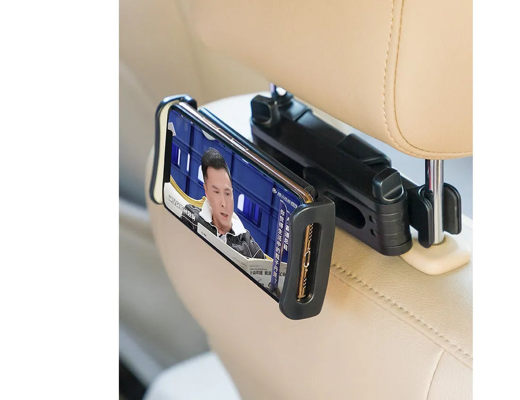 Black car phone holder attached to vehicle rear seat base with universal bracket holding tablet