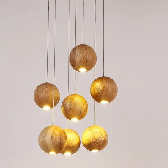 Nordic style solid wood ball chandelier hanging from ceiling with adjustable cord