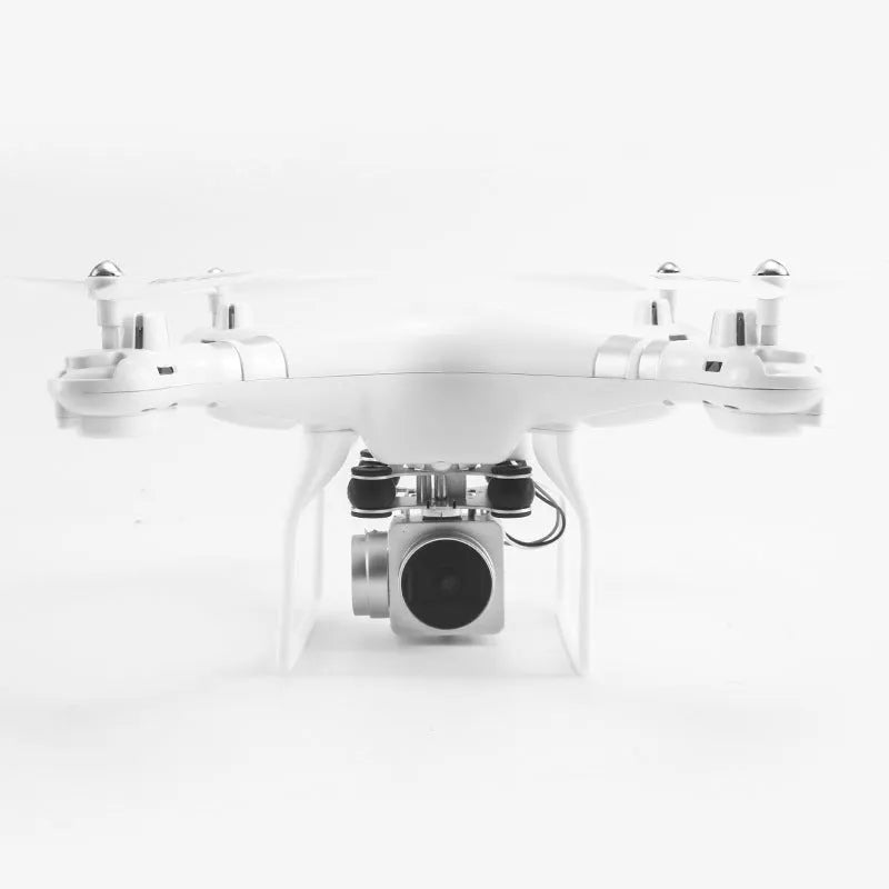 Black HD aerial photography drone with remote control handle on a table