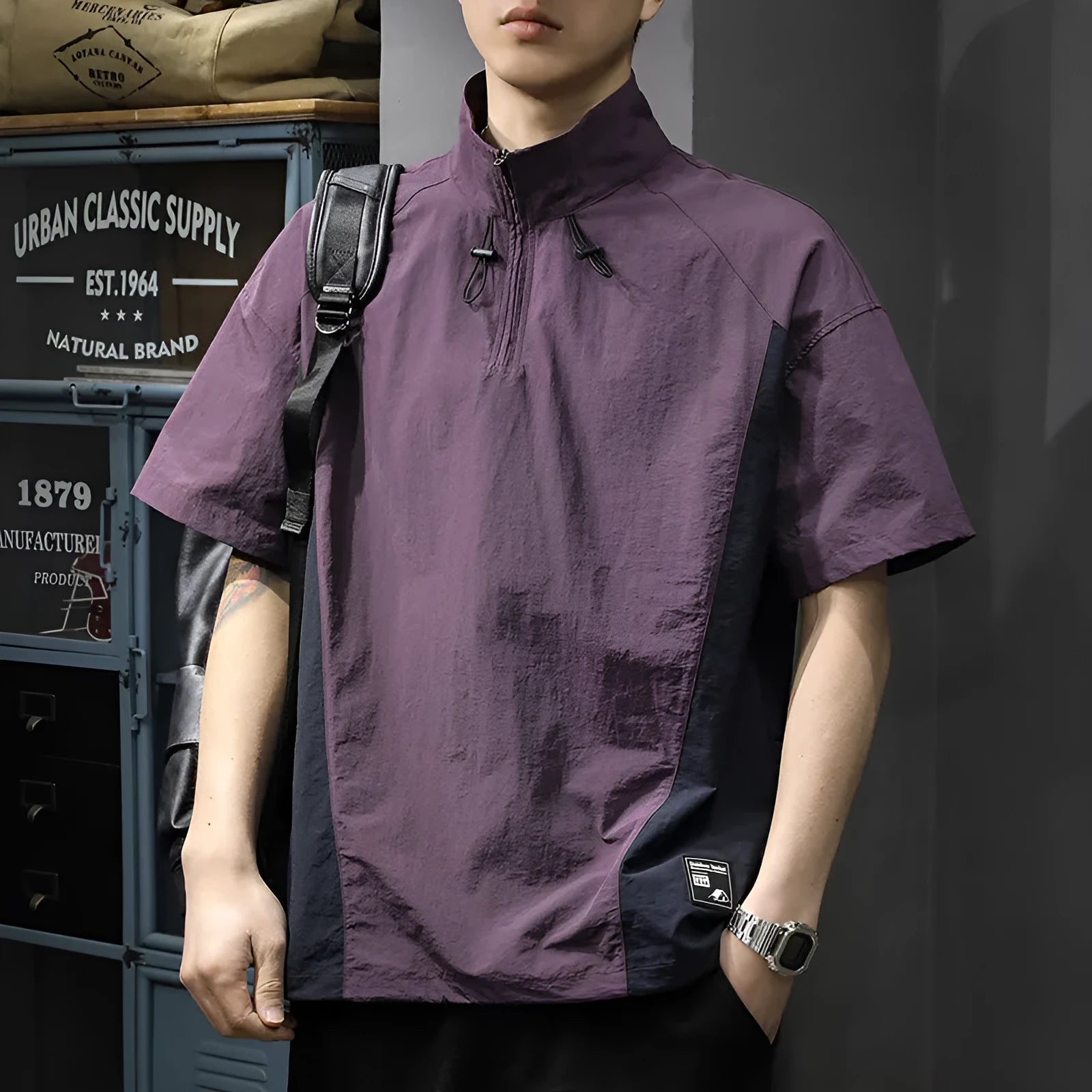 Men's brown half-zip short sleeve casual shirt with a stand collar, shown in a loose fit.