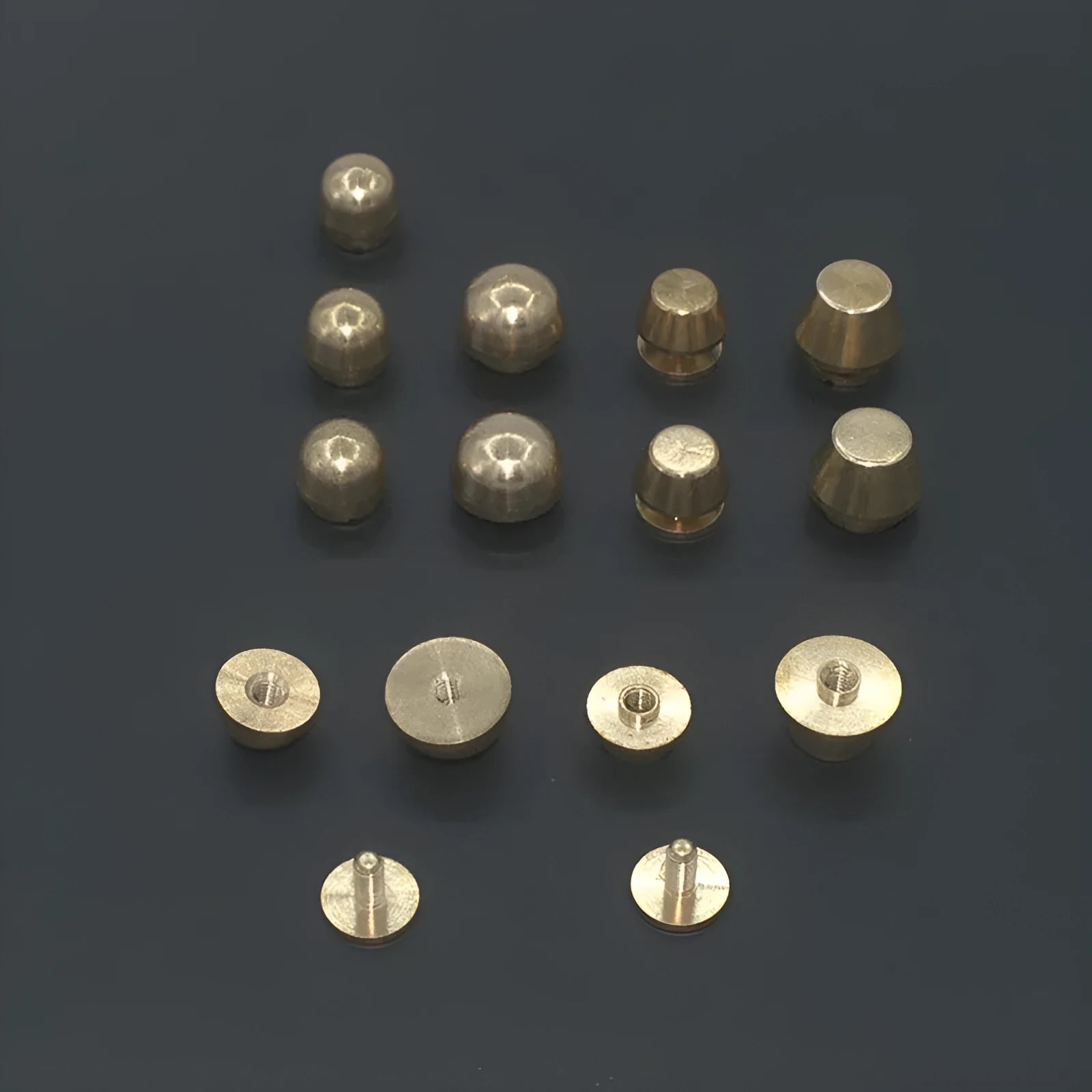 Brass decorative buckles in 10x6mm and 12x7mm sizes with round and geometric foot nail designs