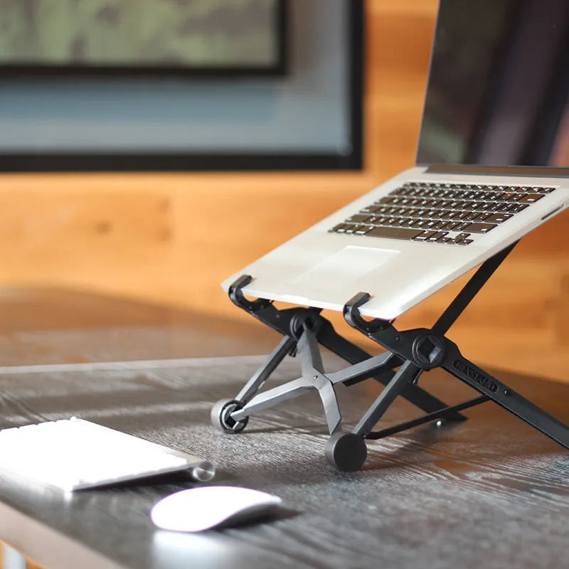 Black folding portable laptop stand made of reinforced nylon with compact dimensions