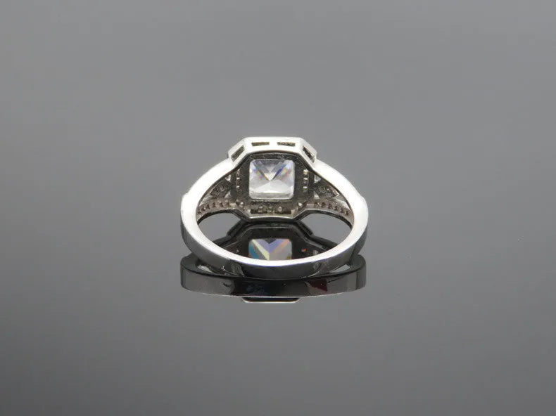 Platinum-colour geometric women's ring with hollow design and zircon inlay