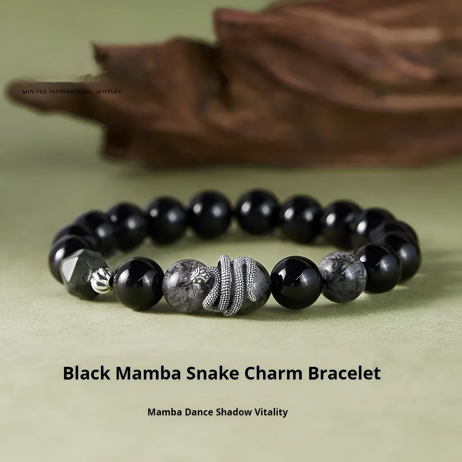 Men's black snake bracelet in sterling silver with obsidian detailing showing 10mm diameter