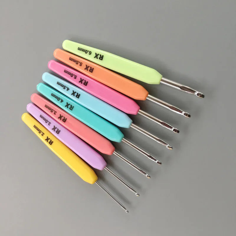 Set of 16 crochet hooks with soft and hard handles in a black PU storage bag.