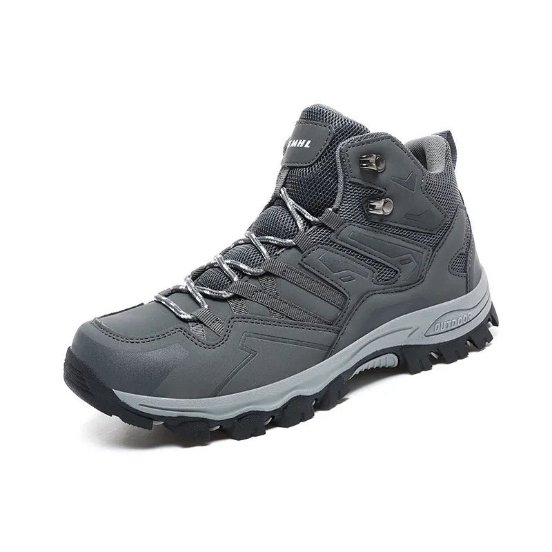 High-top hiking sneakers in multiple colours with flannel uppers and rubber soles on a rocky path.