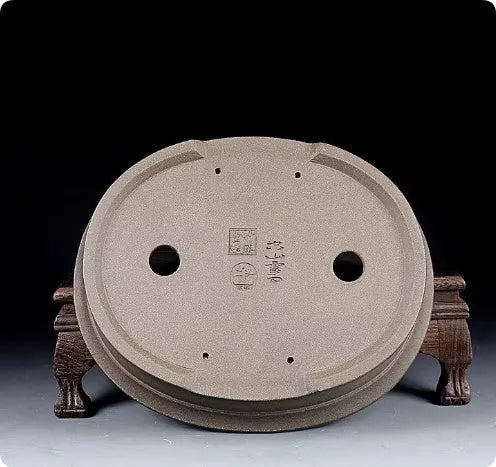Handmade purple sand ceramic bonsai pot with antique oval design measuring 25x21x6.3cm