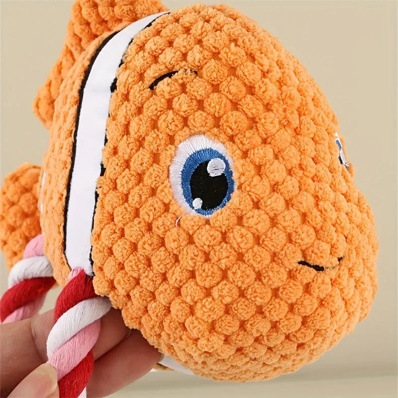 Turtle-shaped dog chewing toy with plush fabric and knotted rope in grey colour