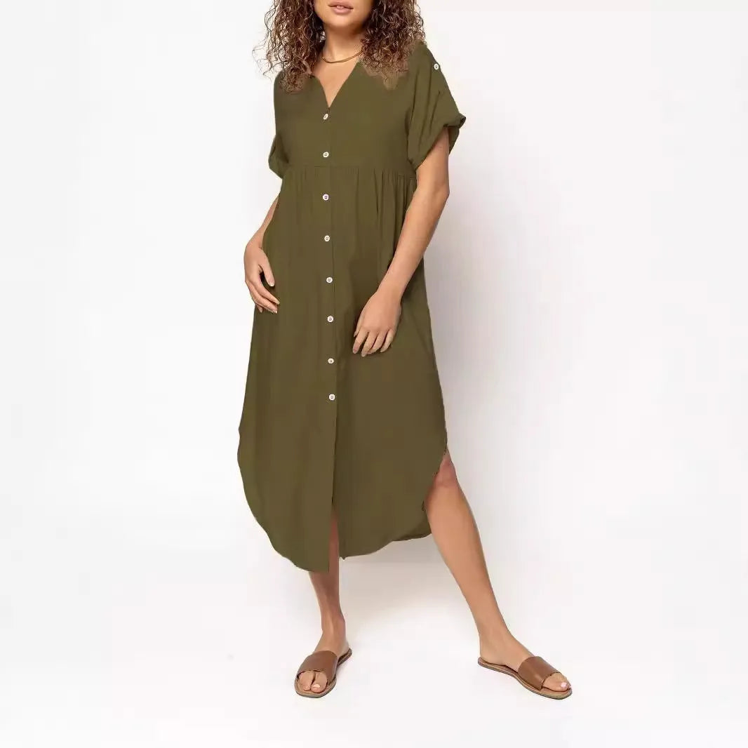 A loose-fitting, solid-colour mid-length casual dress with a front button closure and regular sleeves.