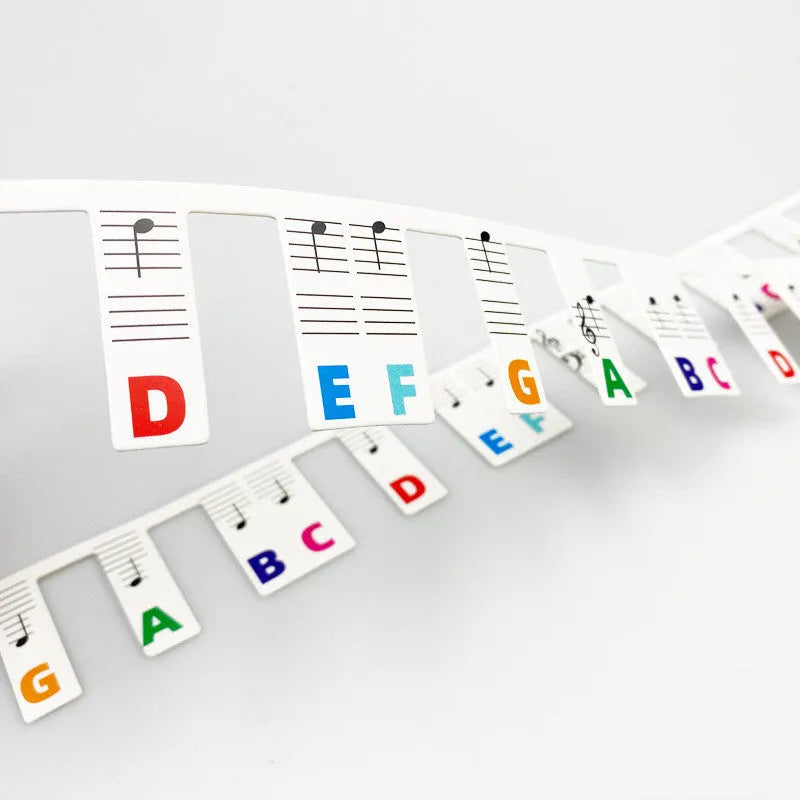 White cardboard piano stickers for 88-key keyboards in black notes or colour bar options