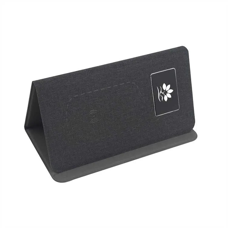 Folding wireless charging mouse pad set showing cloth surface with separate wireless mouse and compact folded size